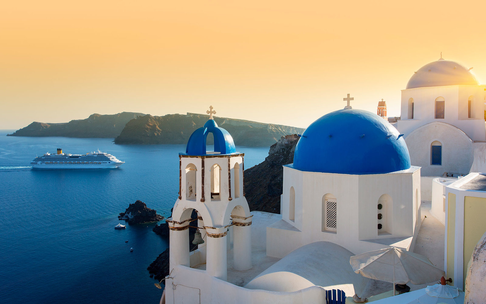 Santorini May Be Capping Tourist Numbers, If You're Traveling By Cruise